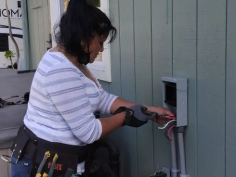 Licensed electrician wiring an exterior subpanel in Sturgis