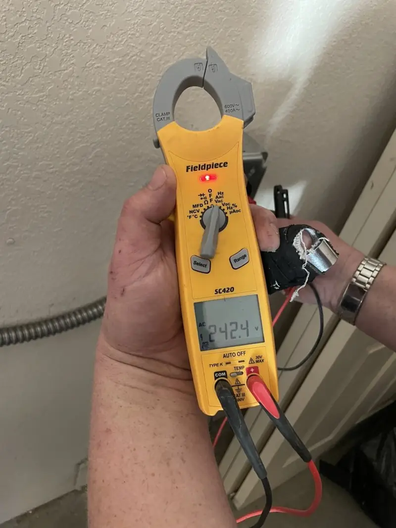 Voltage testing with clamp meter during Electrical Installation Services in Sturgis